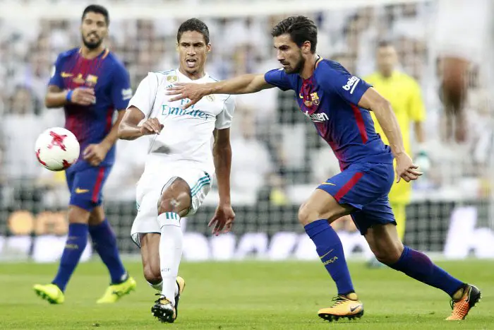 Real Madrid's Raphael Varane (l) and FC Barcelona's Andre Gomes during Supercup of Spain 2nd match. August 16,2017.