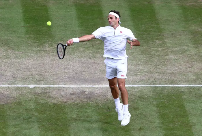 Tennis - Wimbledon - AllHnglandHawn Tennis and Croquet Club, London, Britain - July 10, 2019  Switzerland's Roger Federer in action during his quarter final match against Japan's Kei Nishikori