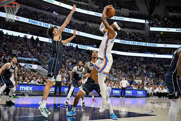 May 13, 2024; Dallas, Texas, USA; Oklahoma City Thunder guard Shai Gilgeous-Alexander (2) shoots over Dallas Mavericks center Dereck Lively II (2) during the second quarter in game four of the second round for the 2024 NBA playoffs at American Airlines Center. Mandatory Credit: Jerome Miron-USA TODAY Sports/Sipa USA   - Photo by Icon Sport