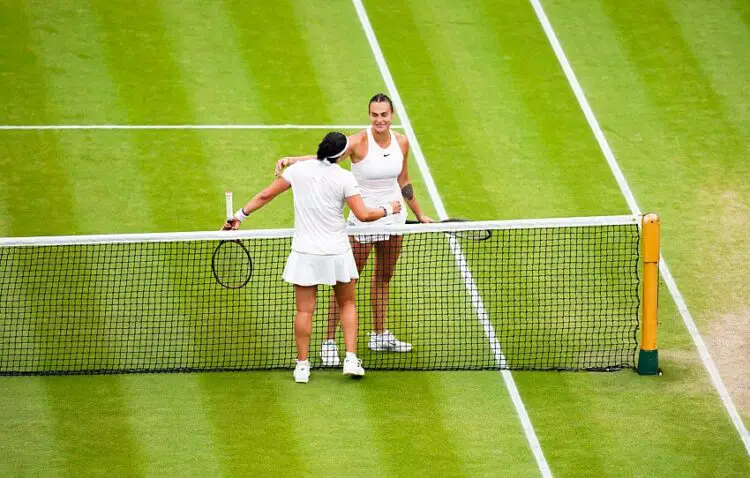 Ons Jabeur consoles Aryna Sabalenka at the net following the Ladies Singles - Semi-Final match on day eleven of the 2023 Wimbledon Championships at the All England Lawn Tennis and Croquet Club in Wimbledon. Picture date: Thursday July 13, 2023. - Photo by Icon sport   - Photo by Icon Sport