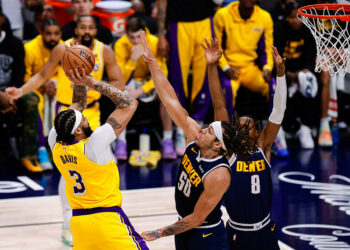 Apr 29, 2024; Denver, Colorado, USA; Los Angeles Lakers forward Anthony Davis (3) attempts a shot against Denver Nuggets forward Aaron Gordon (50) and forward Peyton Watson (8) in the fourth quarter during game five of the first round for the 2024 NBA playoffs at Ball Arena. Mandatory Credit: Isaiah J. Downing-USA TODAY Sports/Sipa USA   - Photo by Icon Sport