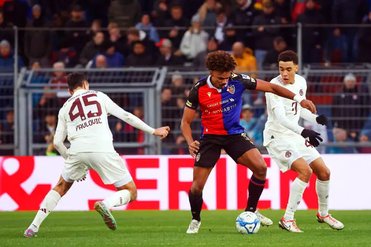 06 January 2024, Switzerland, Basel: Soccer: Test matches, FC Basel - FC Bayern Munich: Renato Veiga (FC Basel, M) defends the ball against Aleksandar Pavlovic (FC Bayern, l) and Jamal Musiala (FC Bayern, r). Photo: Philipp von Ditfurth/dpa - Photo by Icon sport   - Photo by Icon Sport