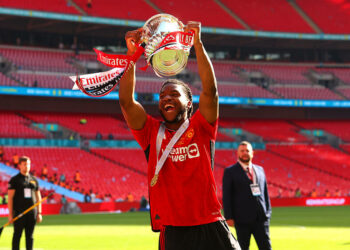 25th May 2024;  Wembley Stadium, London, England; FA Cup Final Football, Manchester City versus Manchester United; Willy Kambwala of Manchester United celebrates with the FA Cup trophy in front of the Man Utd fans   - Photo by Icon Sport