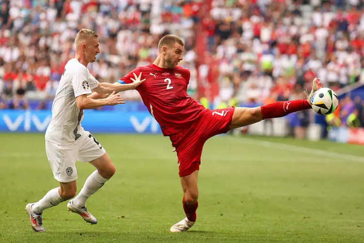 Strahinja Pavlovic (R) of Serbia and Zan Karnicnik (L) of Slovenia seen in action during the UEFA EURO 2024 group stage match between Slovenia and Serbia at Munich Football Arena. (Final score; Slovenia 1:1 Serbia) (Photo by Sergei Mikhailichenko / SOPA Images/Sipa USA)   - Photo by Icon Sport