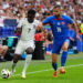 England's Bukayo Saka (left) and Slovakia's David Hancko battle for the ball during the UEFA Euro 2024, round of 16 match at the Arena AufSchalke in Gelsenkirchen, Germany. Picture date: Sunday June 30, 2024.   - Photo by Icon Sport