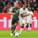 Harry Kane (Bayern Munich) face à Jonathan Tah (Bayer Leverkusen) - Photo by Icon Sport